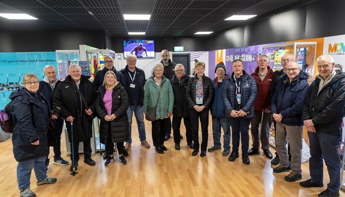 A group of people standing next to each other in the Museum of World Athletics in St Enoch's Centre in Glasgow.