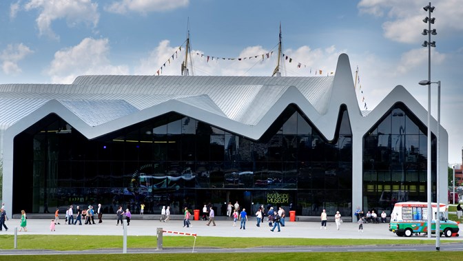 Photograph showing the front car park entrance to Riverside Museum with visitors in the foreground
