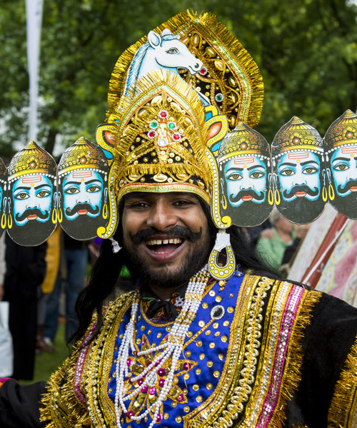 Man wearing ornate head dress at Glasgow Mela