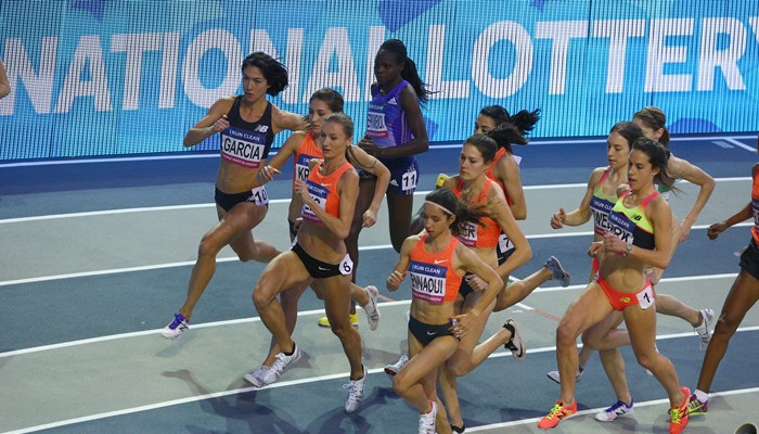 A group of female athletes taking part in a running race