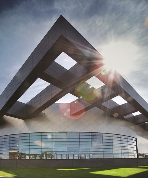View of Emirates Arena from outside with sun shinning in the background 