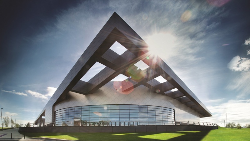 View of Emirates Arena from outside with sun shinning in the background