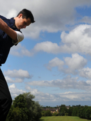 A man playing golf