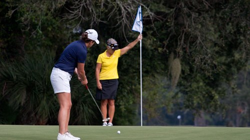 Two ladies playing golf