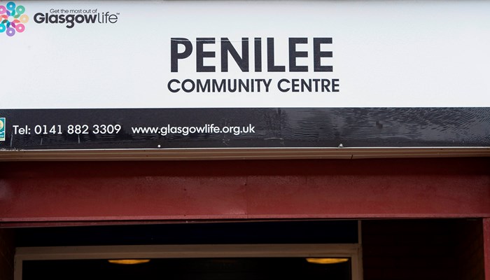 sign above a door that stats penilee community centre