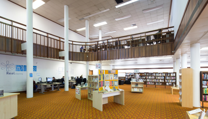 Book displays in Hillhead library. In the background is the mezzanine.