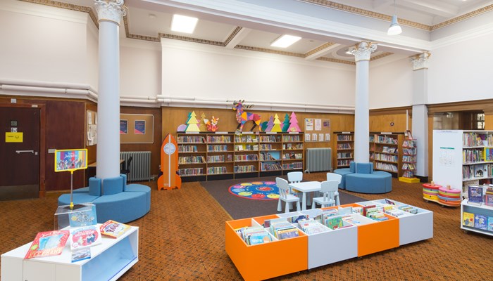 The children's area at Maryhill Library, featuring colourful book stands and chairs.