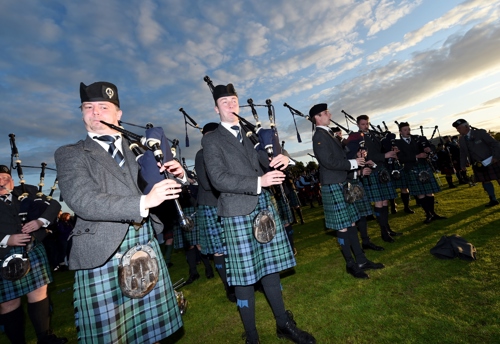 Pipers competing in the World Pipe Band Championships. They wear traditional kilts.