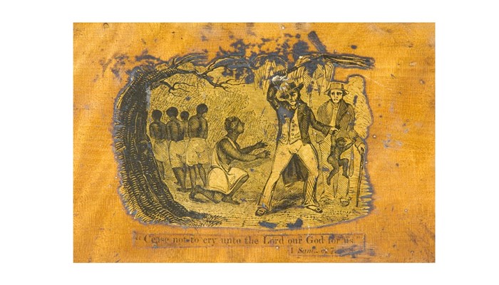 the lid of a orange-yellow wooden box showing an ornate engraving of figures inside a scene