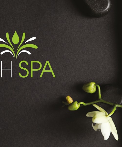 Image shows a dark background with bamboo and flowers, included Refresh Spa logo
