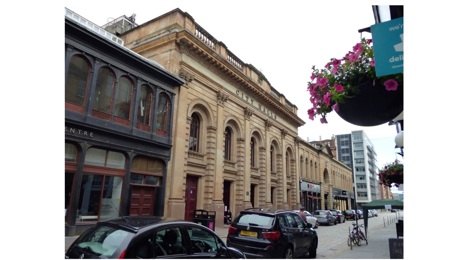 an image showing the front of Glasgow City Halls - the building has 5 tall archways along the facade.