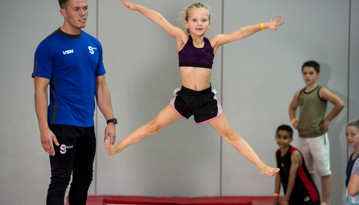 Girl star jumping on trampoline 