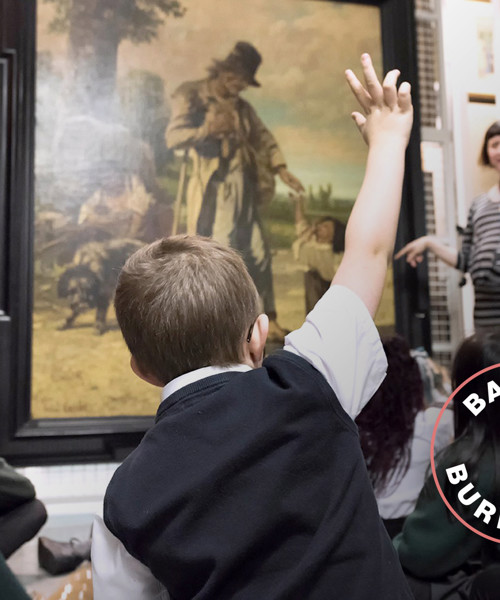 Curator showing objects to visitors