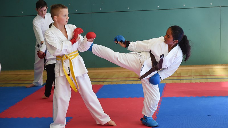 Two young people doing martial arts