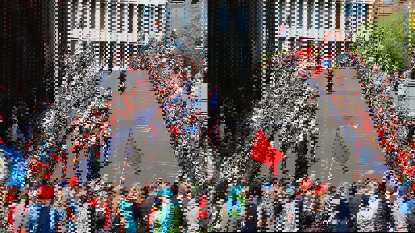 Professional cyclists racing up a hill on Montrose Street in Glasgow