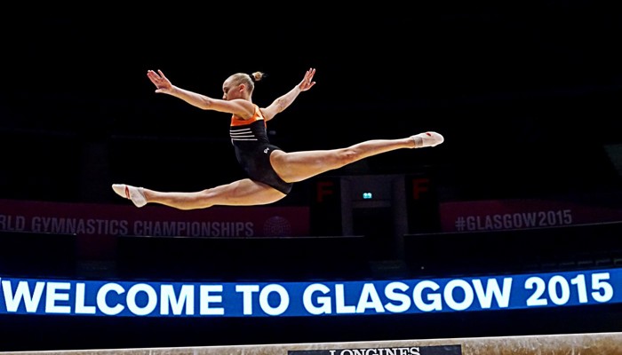 A gymnast in mid-air after jumping from a balance beam during the 2015 World Gymnastics Championships at the Hydro in Glasgow.