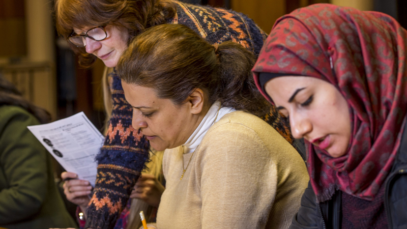 Learners sitting at table