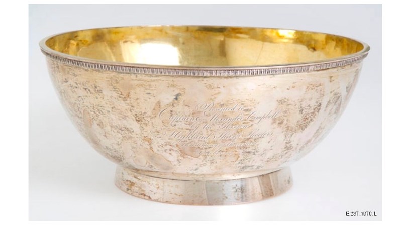 silver engraved bowl with a gold-ish interior