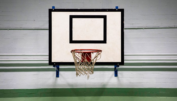 basketball net. the board behind is white with black lines surrounding the board
