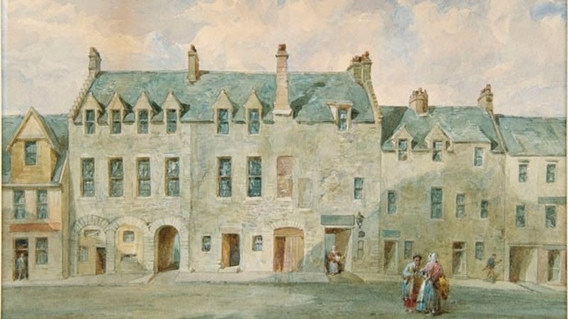 a small painting showing a row of white houses with grey slate roofs