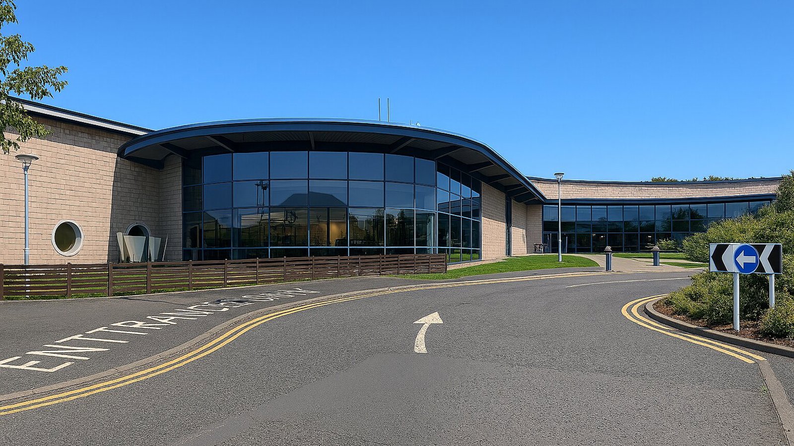 A leisure centre is pictured beneath a blue sky