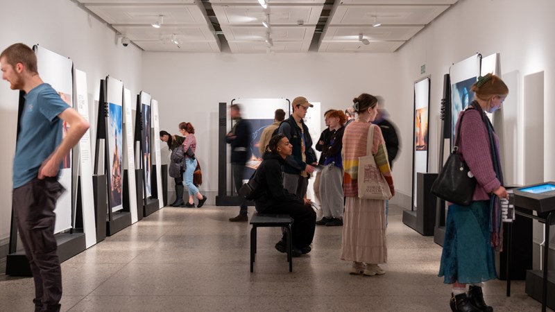 Photograph showing people attending Journey's of the Mind, a temporary exhibition at Kelvingrove Art Gallery and Museum