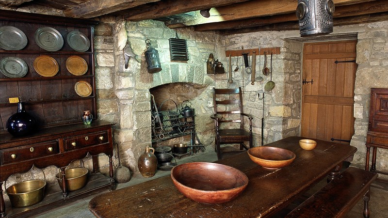 Photograph showing the interior of Provand's Lordship featuring a dining table in stone room.