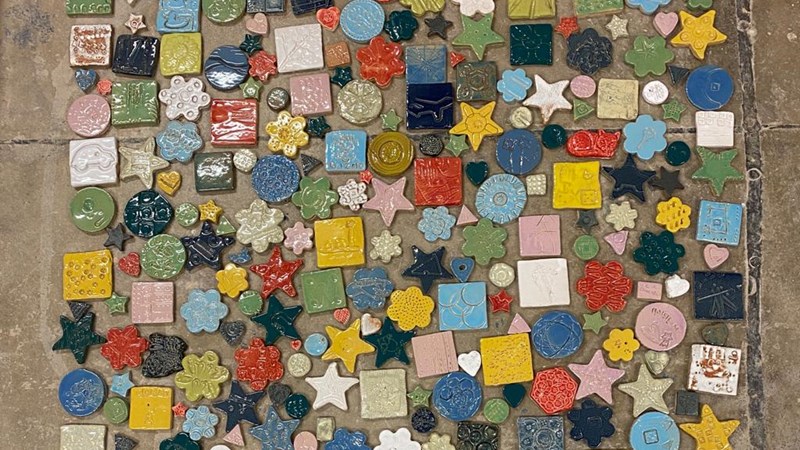 Small colourful ceramic tiles displayed together