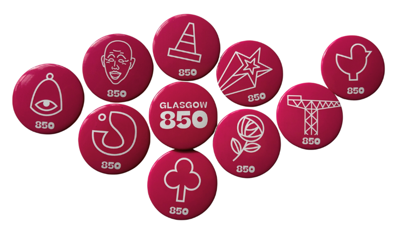 collage of pink pin badges with various icons on them including the text Glasgow 850, a crane, a bell and a traffic cone.