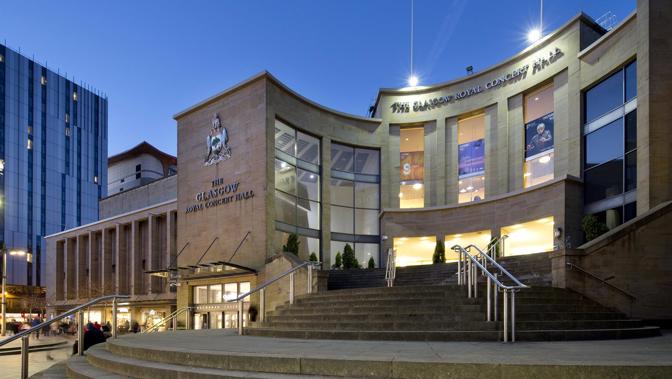 Exterior of Glasgow Royal Concert Hall at dusk, showing the main entrance, steps and illuminated facade.