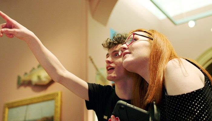 Photograph showing young people using My Stories in Kelvingrove Museum and Art Gallery