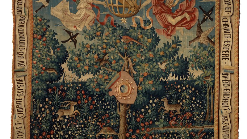a large tapestry showing a scene with animals and floating figures around a globe-shaped cage.