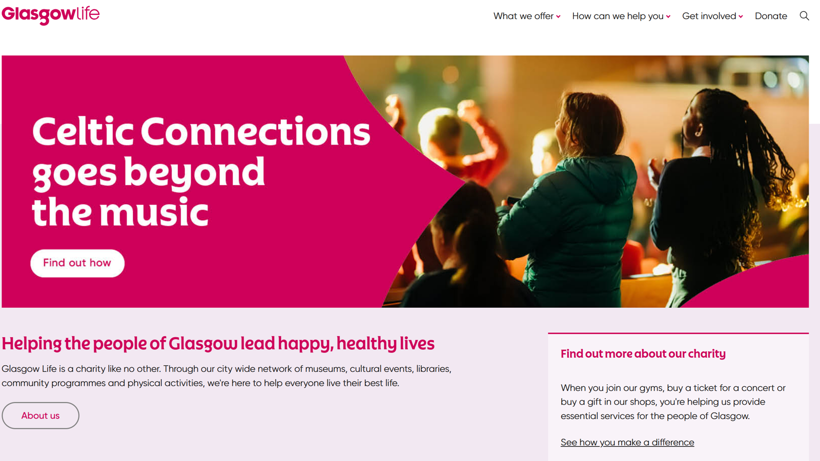 An image of a website homepage. The banner on the website shows people in a crowd. 