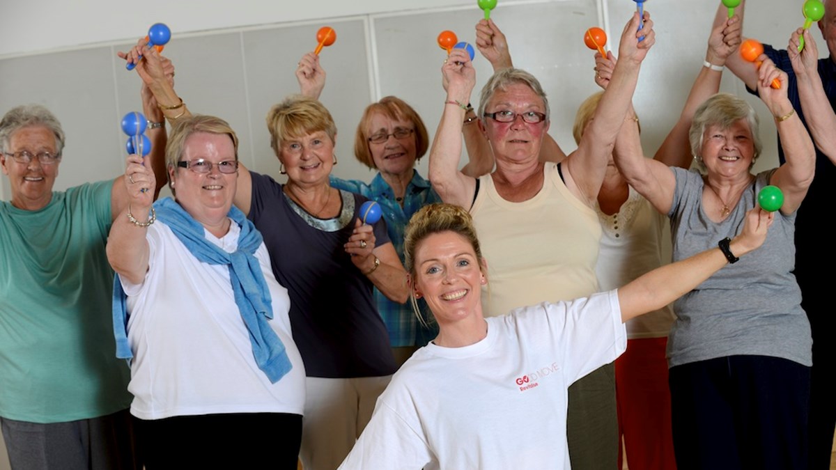 A group of people smiling after taking part in the Live Well Community Referral programme.