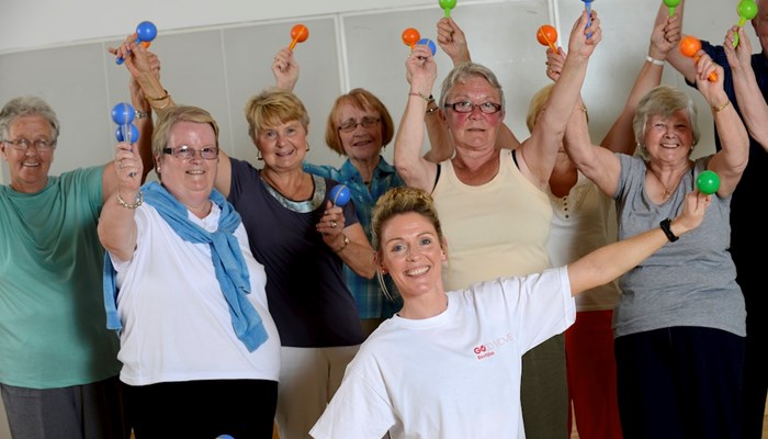 A group of people smiling after taking part in the Live Well Community Referral programme.