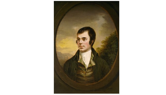 a photograph of a circular painting of the young poet Robert Burns, looking off to the left.