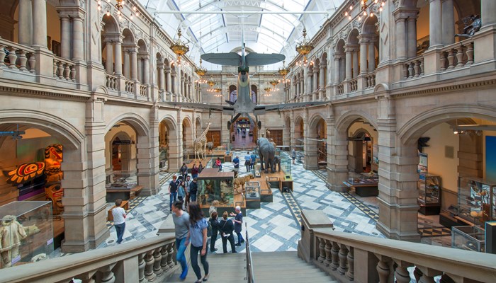 Photograph showing a view of the West Court inside Kelvingrove Art Gallery and Museum, including a Spitfire!