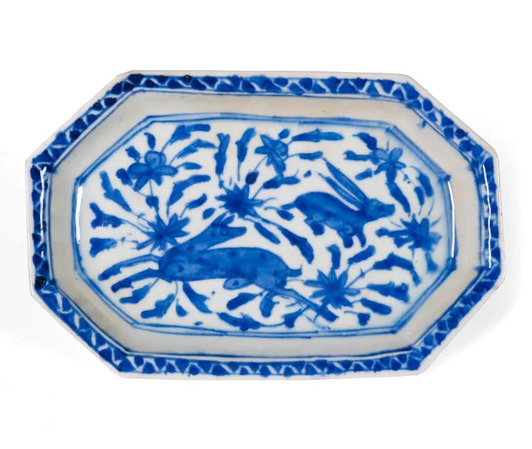 photograph of an oblong plate with cobalt blue design.