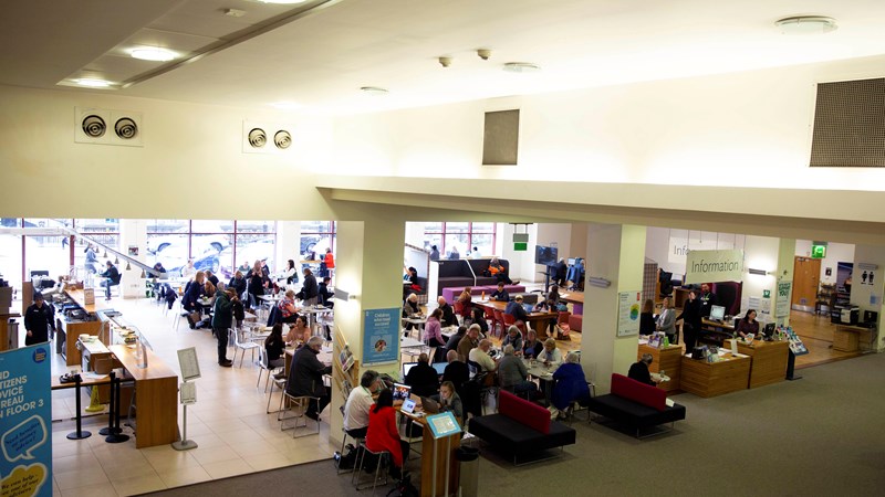 People congregate in the Mitchell Library Cafe space.