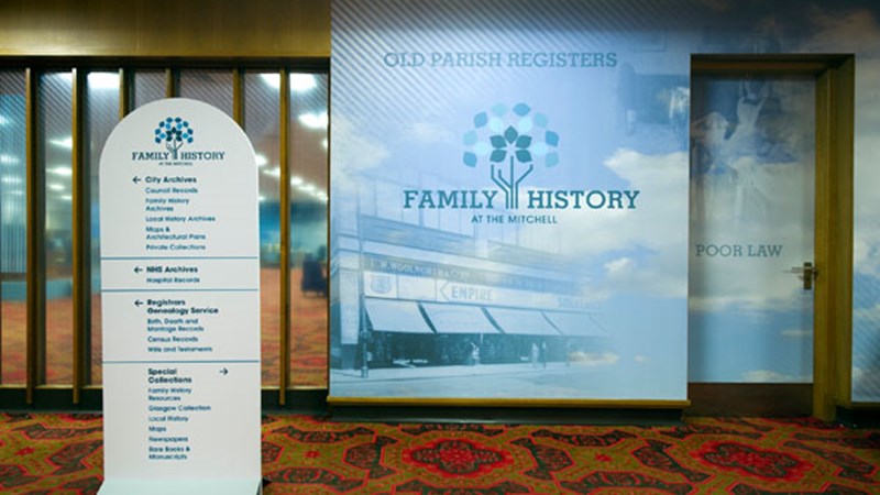 Photo showing The Family History centre branding and directional signage at The Family History Centre within The Mitchell Library