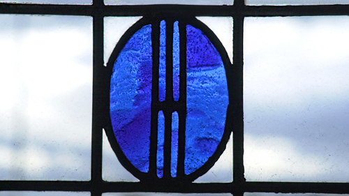 Photograph showing a window detail designed by Charles Rennie MacIntosh.