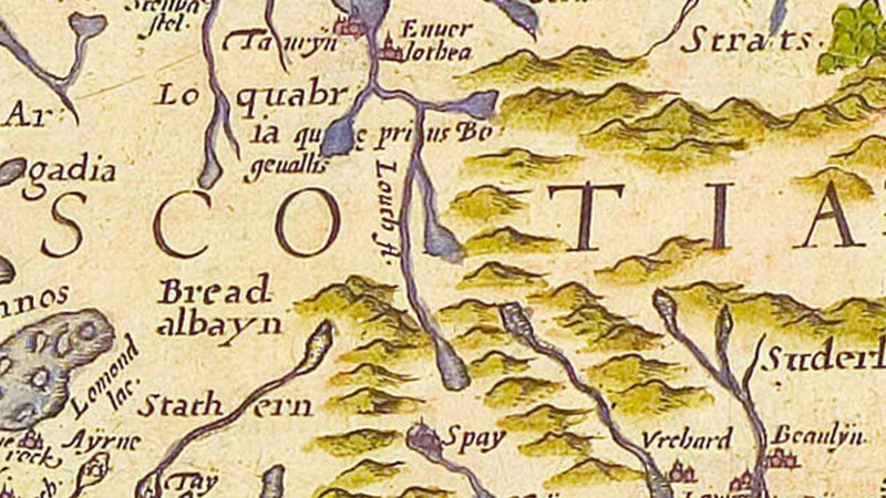 An old fashioned map on parchment with areas and place names written in scrolled writing