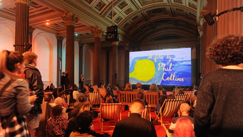 Photograph showing a film by Phil Collins, screening in gallery one, GoMA.