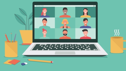 Illustration of a laptop on a desk showing several people taking part in an online classroom session