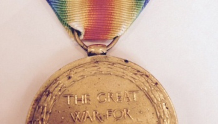 Thomas Moran's medal, which is gold with a rainbow coloured lanyard, for The Great War of Civilisation 1914-1919, inscribed with Thomas’ name and regimental number. 