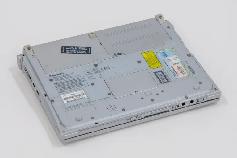 a photograph of a grey laptop