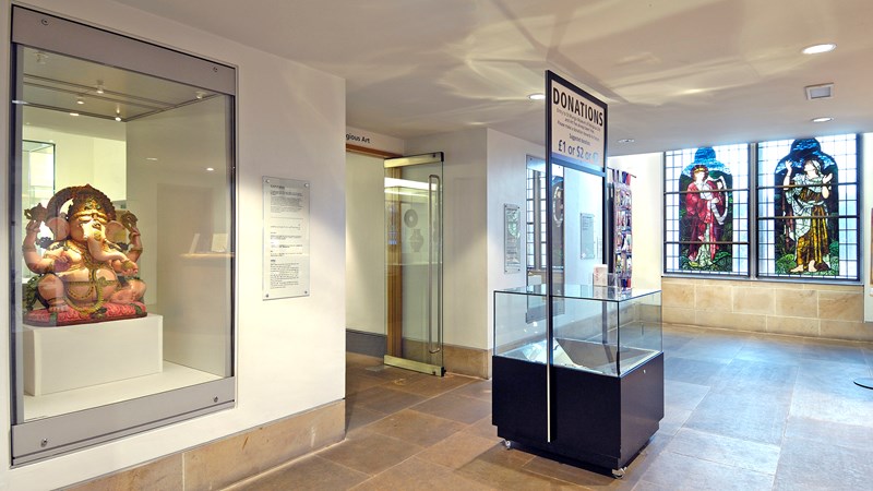 Photograph of the foyer of St Mungo Museum and a donation box.