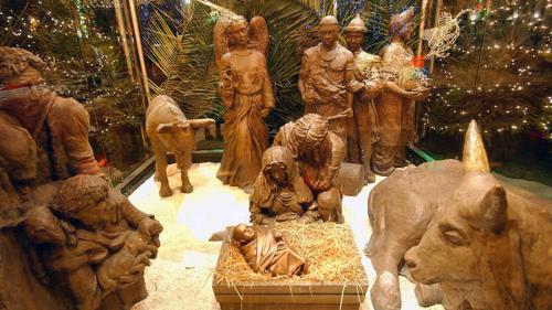 traditional wooden nativity scene with baby Jesus 