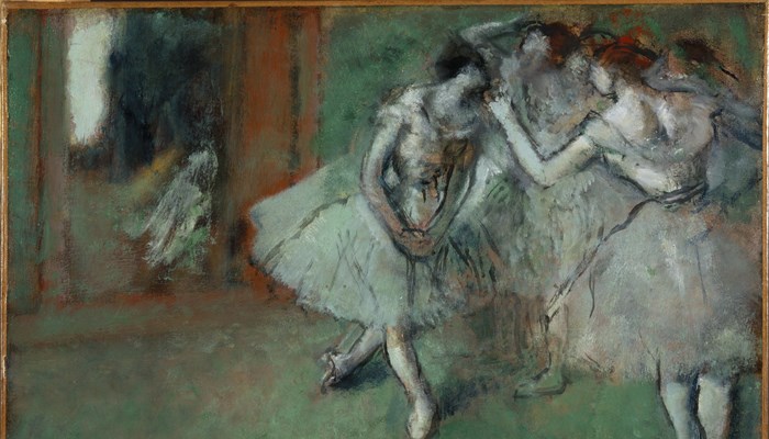 Image of Degas painting entitled A Group of Dancers, which shows some ballerinas chatting to each other.