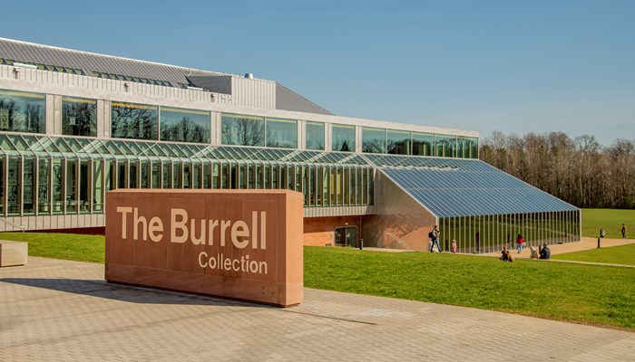 An exterior shot of the refurbished Burrell Collection building on a sunny day in Pollok Country Park.